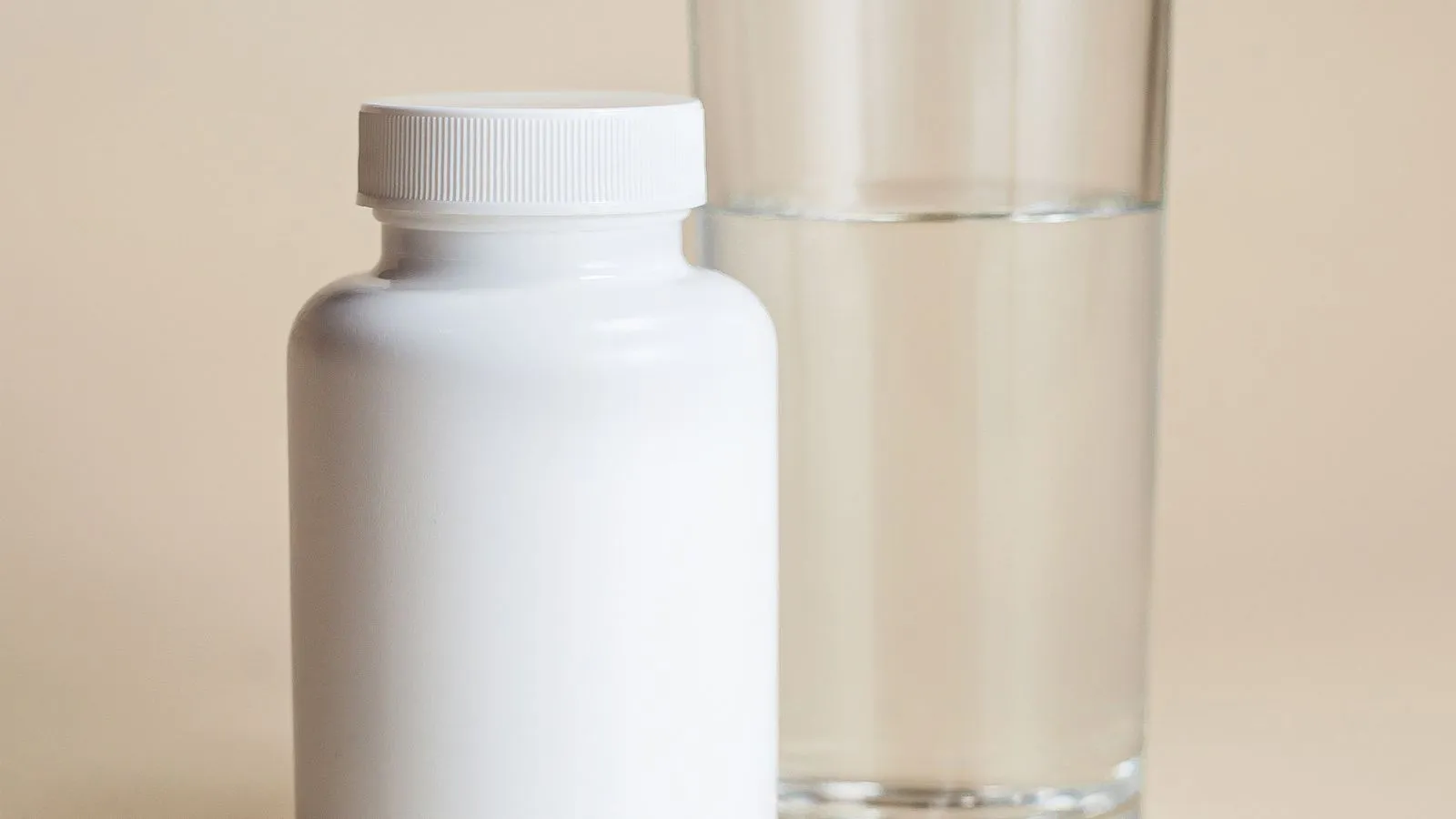 Magnesium supplement capsules on a wooden surface